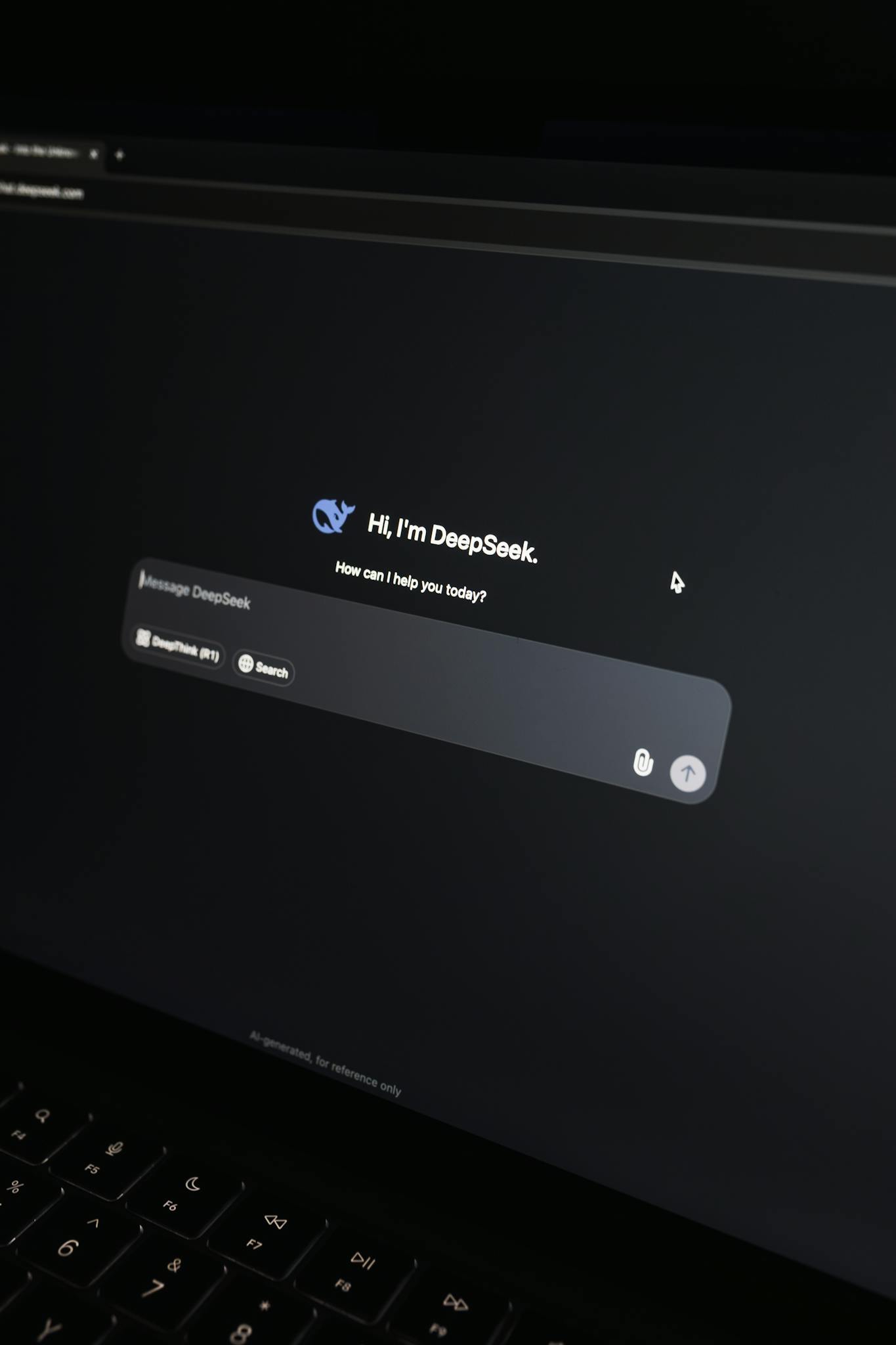Close-up of an AI chat interface on a laptop screen in a dark setting.